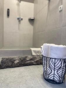 a black and white bathroom with a towel at Hotel Femina in Zhytomyr