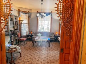 a living room with a couch and a table at Innisfree Bed & Breakfast in South Bend