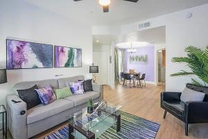 a living room with a couch and a table at Golf View Oasis-Serenity-Tranquility-Walkability N244 in Scottsdale