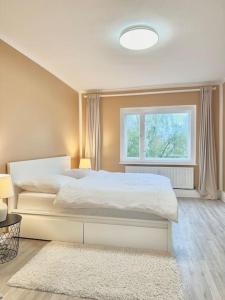 a bedroom with a white bed and a window at 2Room Apartment in Best Place in Berlin
