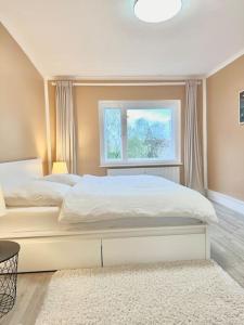 a bedroom with a white bed and a window at 2Room Apartment in Best Place in Berlin