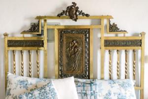 a bedroom with a bed with a painting on the wall at Resort Nuvola Srls in Ripabottoni