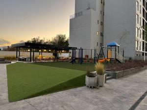 a park with a playground with a playground at Departamento LIVA estadio Akron zona real in Guadalajara