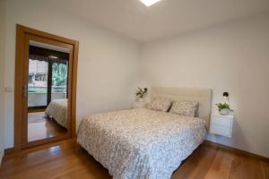 מיטה או מיטות בחדר ב-Apartamento Haitz