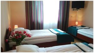 Säng eller sängar i ett rum på GoGreen Hotel