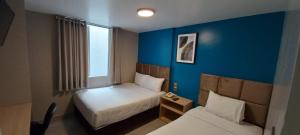 Cama ou camas em um quarto em Hotel Residencial Alfa