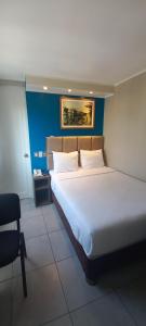 Cama ou camas em um quarto em Hotel Residencial Alfa
