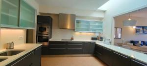 a kitchen with a sink and a counter top at Apartamento Mar&Pol in Palafrugell