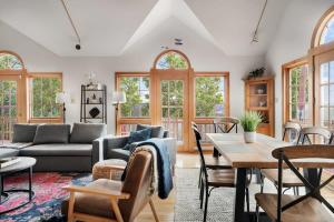 a living room with a couch and a table at Huge 5 Bedroom Modern Cabin wHot Tub, Deck, WiFi in Berkeley Springs +31 photos