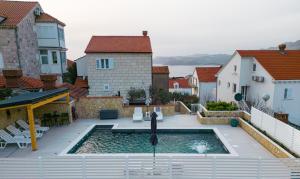 a swimming pool in the middle of a house at Holiday Home Swiss in Cavtat