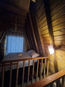 Säng eller sängar i ett rum på Chalés Ilha da Mata Pousada
