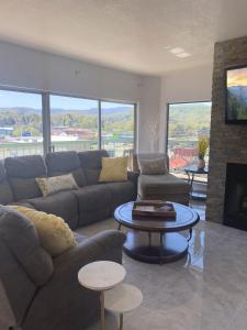a living room with a couch and a table at River Place Condos #711 3BD in Pigeon Forge