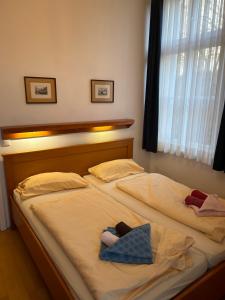 Postel nebo postele na pokoji v ubytování Schöne Ferienwohnung in Seebad Bansin 200m vom Strand (Heringsdorf, Kaiserbäder, Usedom)