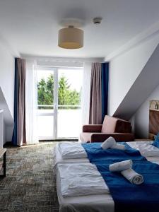 Ένα ή περισσότερα κρεβάτια σε δωμάτιο στο App Standard w Welle