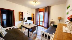 a living room with a couch and a table at NIKO apartment in Santo Stino di Livenza