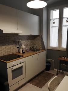 a kitchen with a sink and a counter top at Casa Vacanze Mariposa in Trieste +18 photos