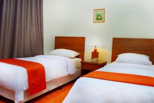 Ένα ή περισσότερα κρεβάτια σε δωμάτιο στο Baduy Condo AA +1 φωτογραφίες