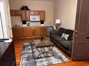 a living room with a couch and a table at Hotel Belvidere in Belvidere