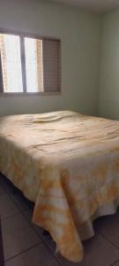 A bed or beds in a room at Casa Inteira e Grande 600MB de Internet. Ótima Loc