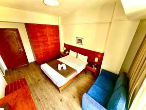 Voodi või voodid majutusasutuse Caesar's Park Hotel toas