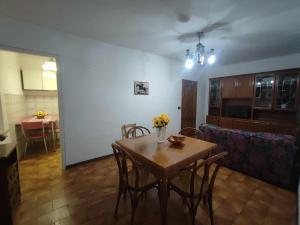 a living room with a table and chairs and a couch at Casa Innocenti Daniele in Volterra