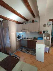 a kitchen with a box in the middle of it at Casa Paolina in Cefalù