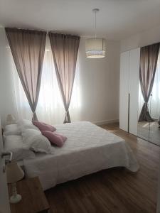 Postel nebo postele na pokoji v ubytování La Casa di Ary