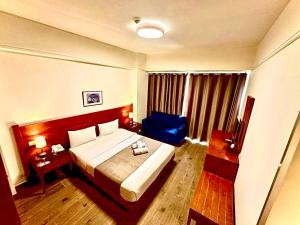 Voodi või voodid majutusasutuse Caesar's Park Hotel toas