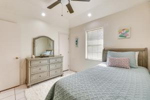 a bedroom with a bed and a dresser and a mirror at Pet-Friendly San Juan Home with Private Yard and Grill in San Juan