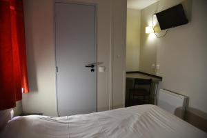 Postel nebo postele na pokoji v ubytování Hotel du Triangle