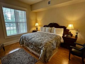 a bedroom with a large bed and a large window at Hotel Belvidere in Belvidere