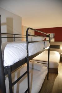 Postel nebo postele na pokoji v ubytování Hotel du Triangle