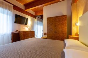Posteľ alebo postele v izbe v ubytovaní Hotel Columbia