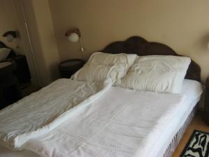 Posteľ alebo postele v izbe v ubytovaní Kitti Apartman