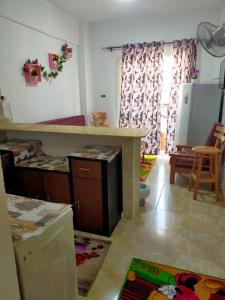 a kitchen and living room with a counter and a table at Blue Lagon resourts in Ras Sedr