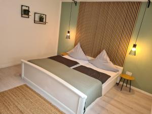 a bedroom with a bed in a room with a window at FeWo Alt Beilstein in Beilstein