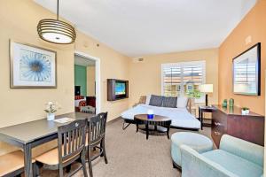 a living room with a couch and a table at Condo Close to Universal Studios - Pool Hot Tub in Orlando