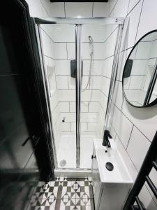 a bathroom with a shower and a sink at Luxury Room, Central London, Ideal for Tourists in London