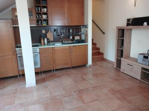 Kuchyň nebo kuchyňský kout v ubytování Apartman Olja