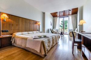 Postel nebo postele na pokoji v ubytování Hotel Doña Brígida – Salamanca Forum