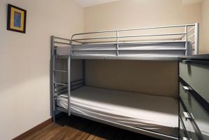 a bunk bed room with two bunk beds in it at Résidence Serias - T3/6pers SERIAS 17- Peyresourde MAE-3524 in Germ