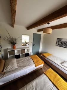 a bedroom with two beds in a room at Vintage Villa B&B in Jastrzębia Góra