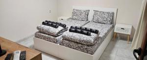 a living room with a couch and a chair at Ново ! Апартамент Dreams 1 in Sliven