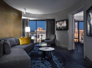 a living room with a couch and a table at The Cosmopolitan Of Las Vegas in Las Vegas