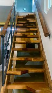 a set of wooden stairs in a house at Casa Edka in Ensenada
