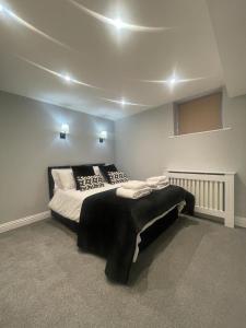 a bedroom with a large bed in a room at Central Windsor in Windsor