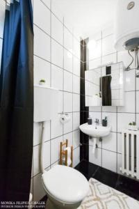 a bathroom with a toilet and a sink at Belgrade Central Station 3 in Belgrade