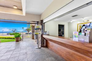 a bar in a building with a view of the ocean at Kahana Villa in Lahaina