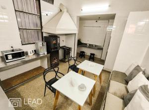 a living room with two tables and a couch at Lead Hostel in Buenos Aires