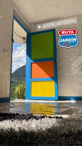 a colorful door in the side of a building at Ruta Jardín in Jardin